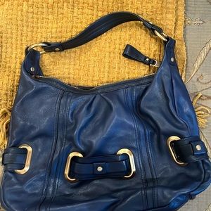 Navy leather purse by B makowsky with gold accent.